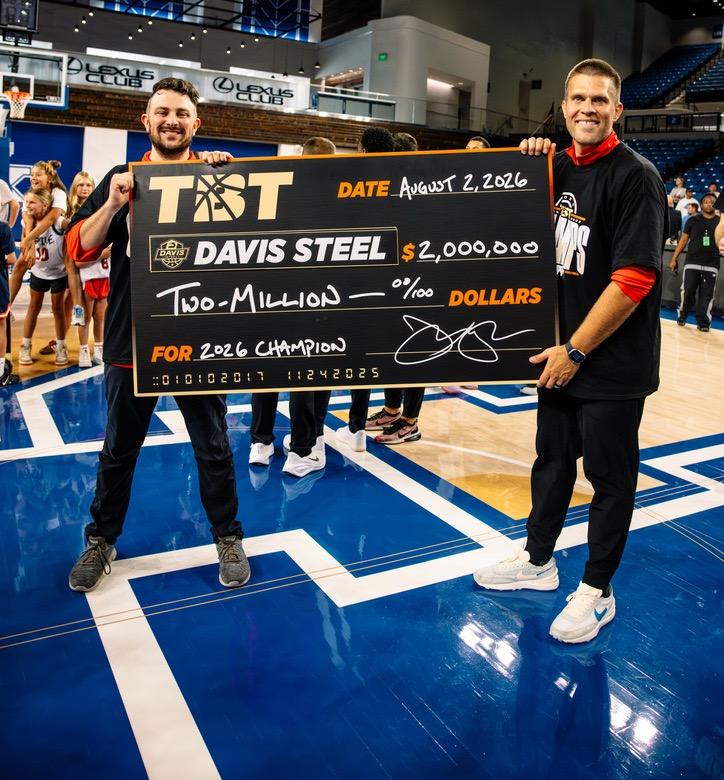 Matt and Jake holding the Davis Steel 2026 championship check